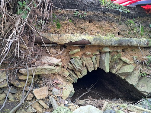 Photo of pipe below road