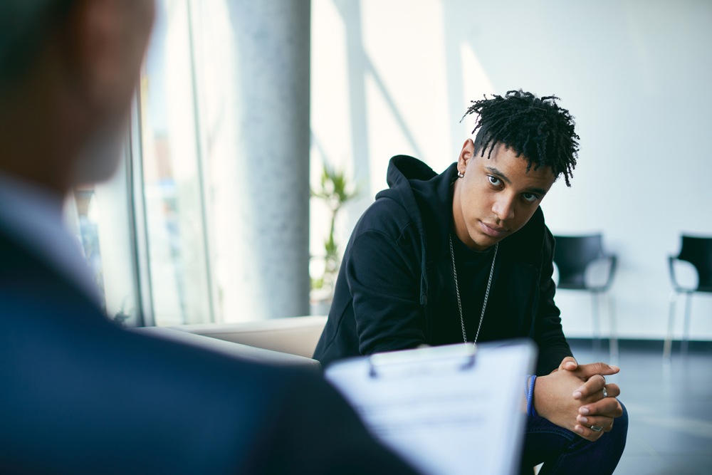 young adult with counsellor