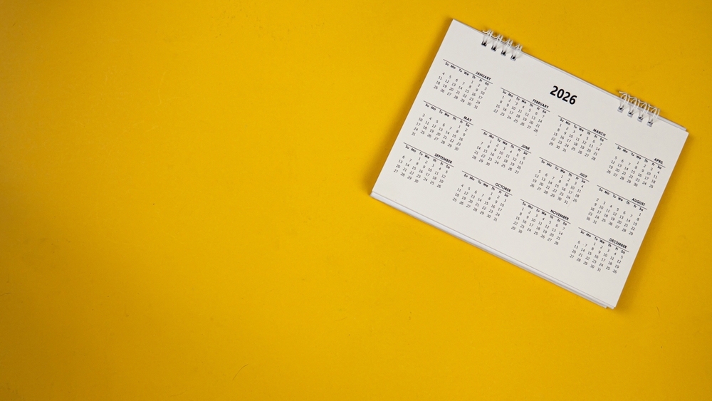 A calendar for 2026 on a yellow background