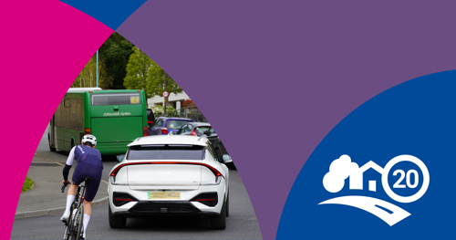 Photo of car driving with cyclist and bus close by