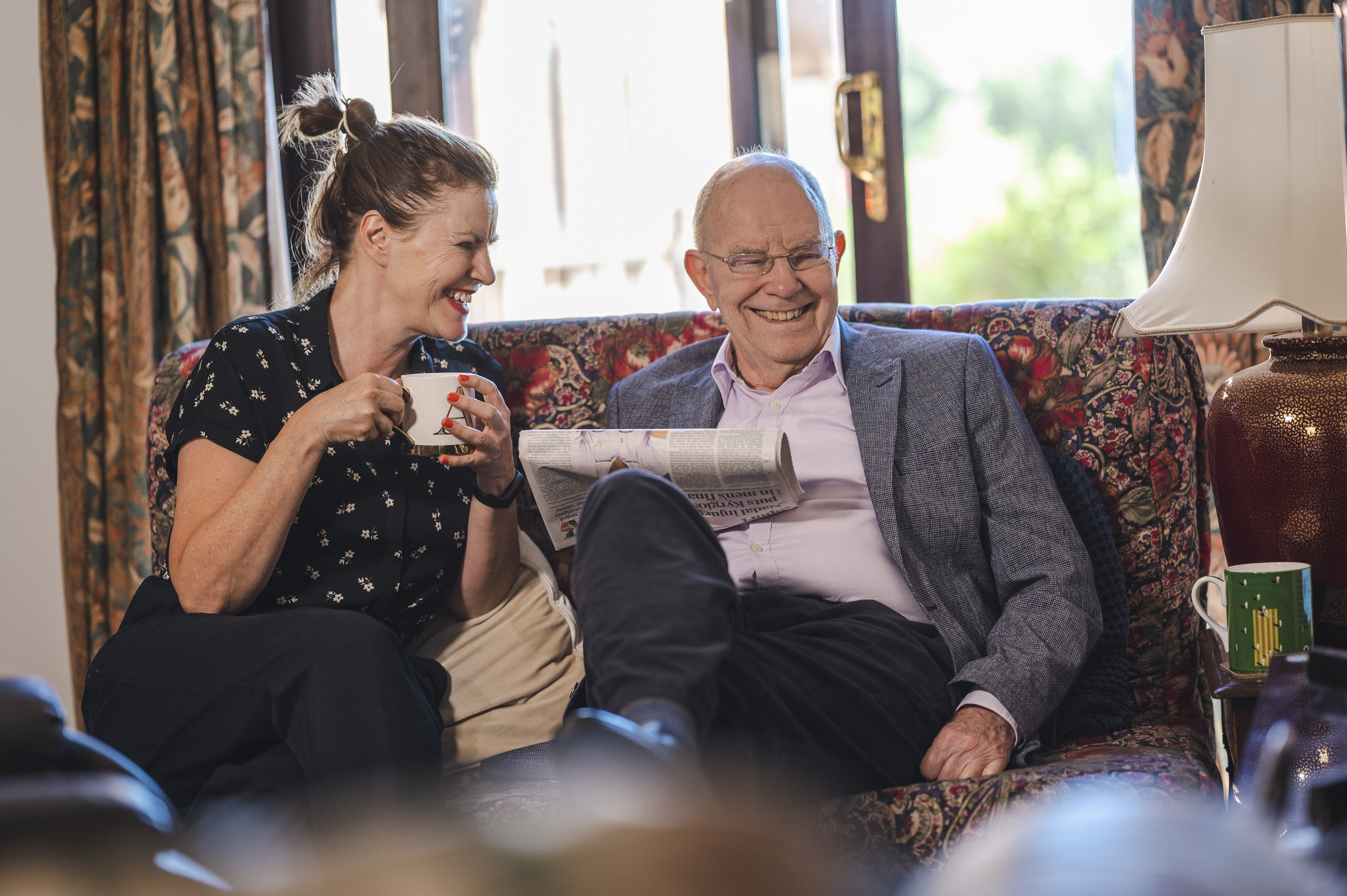 two people having a cup of tea and a chat