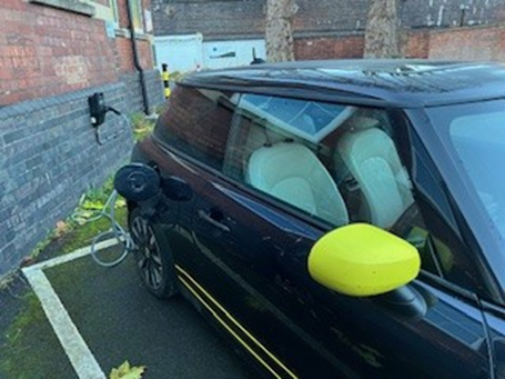 A photo of a car charging up using one of the EV chargers installed at Gloucestershire Heritage Hub
