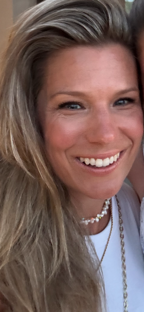 Photograph (of Lara's head and shoulders.  Lara is smiling.