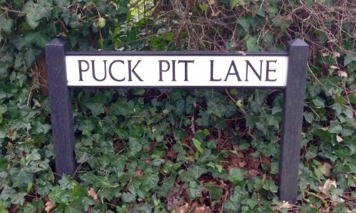 A photo of the road sign for Puck Pit Lane