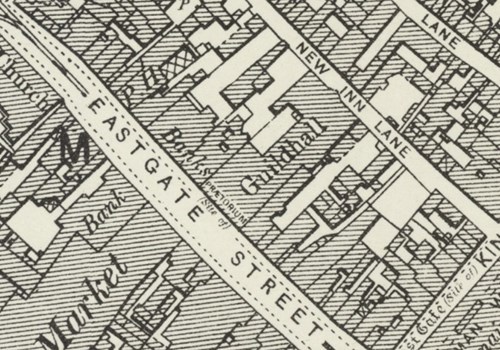 A photo of a historical map, showing the location of the newly rebuilt Guildhall