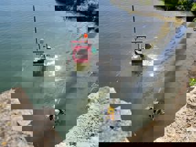 Diver in the water with equipment.