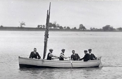An image of 6 men on a boat