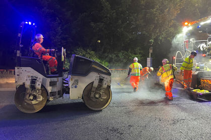 Photo of resurfacing at night with roller machine