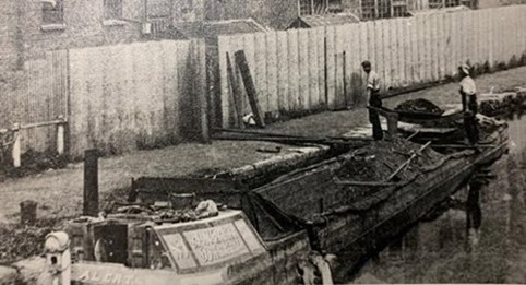 An image of a narrowboat in a canal