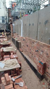 Photo of wall building in process