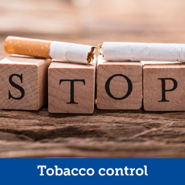 A sign saying stop next to a broken cigarette 