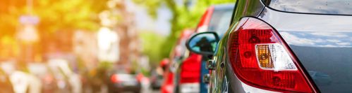 Photo of cars parked on sunny day