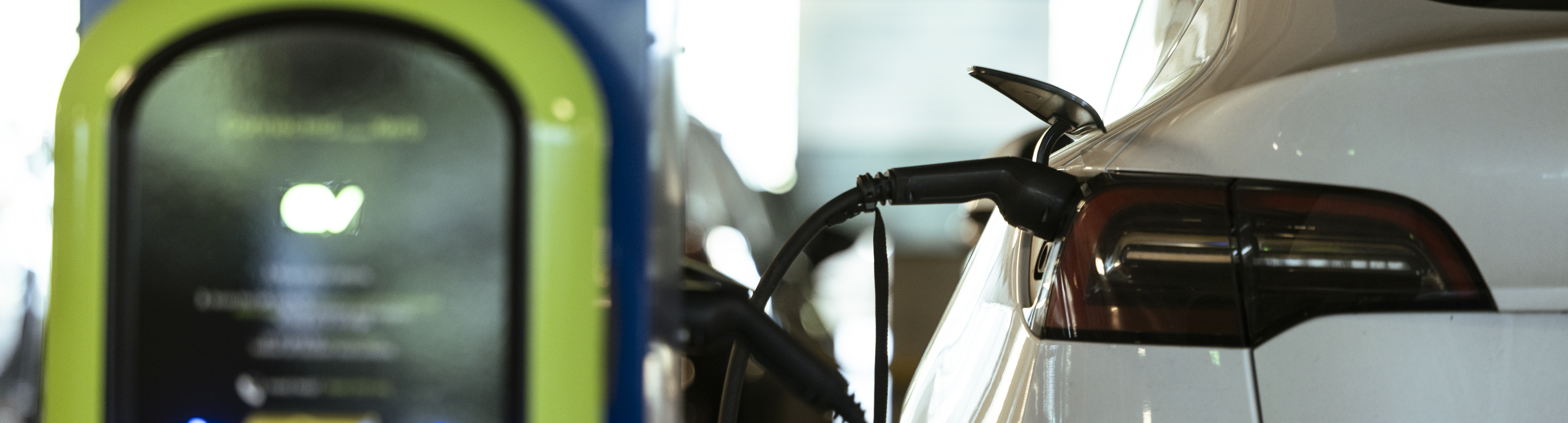 An electric vehicle charging at an EV charging point