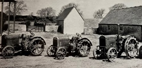 An image of three old Titan tractors