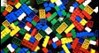 A photo of a pile of coloured building blocks.