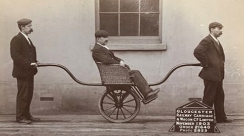 An image of a man sat on a velocipede