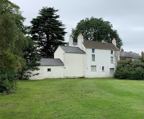 A photo of the green space behind Number 13 Kingsholm Square, where future archaeologists hope to be able to excavate.