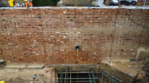View of newly built wall at side of bridge