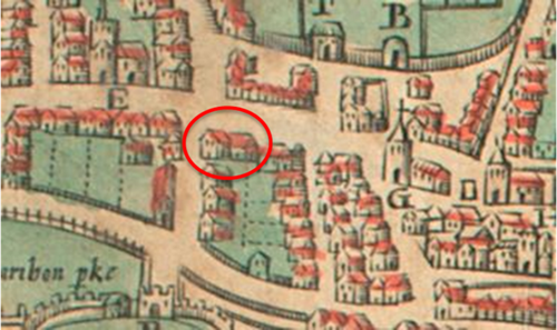 A photo of a medieval map. A red cirlce has been added on the photo to indicate the location of the Gildehall