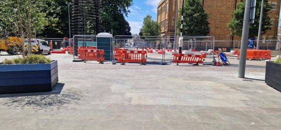 A road construction site with orange barriers

AI-generated content may be incorrect., Picture