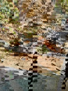 Boulder being dropped by digger