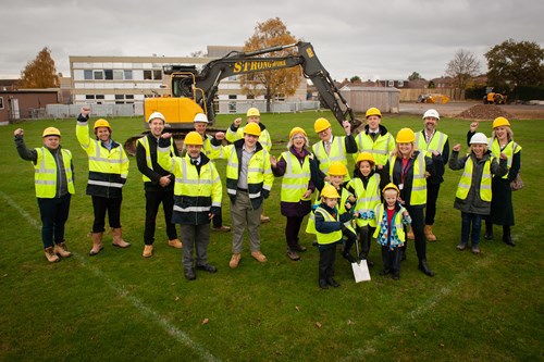 A photo of a group of construction workers on site at Warden Hill Primary School