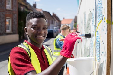 An image of a young person volunteering